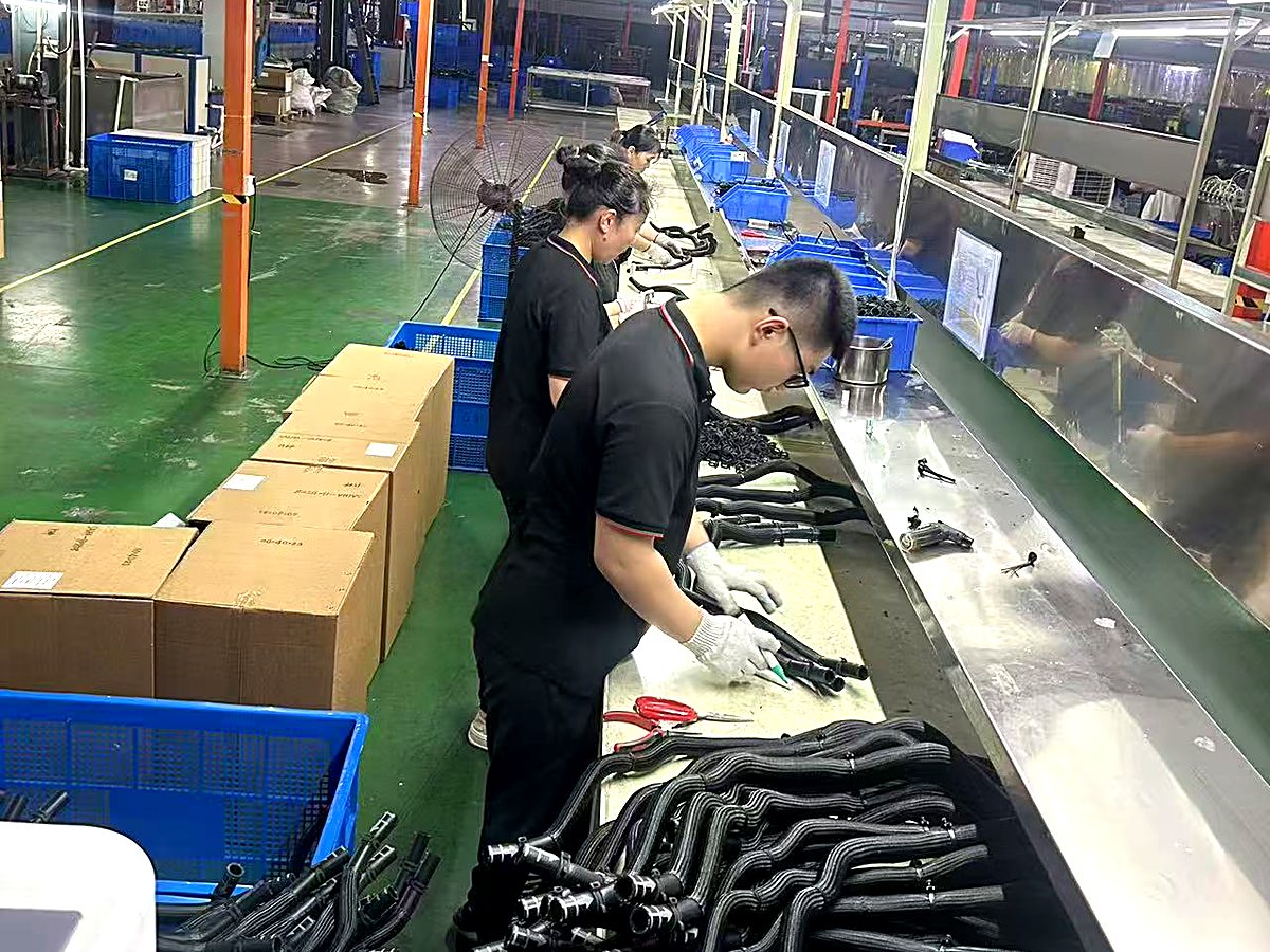 Hose assembly line with trained workers